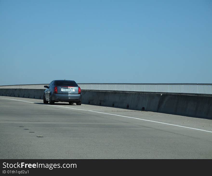 Modern sedan broken down on side of roadway