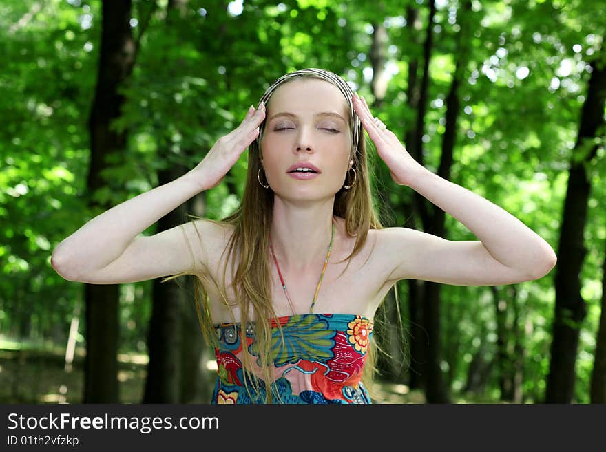 Young woman with closed eyes in summer park. Young woman with closed eyes in summer park