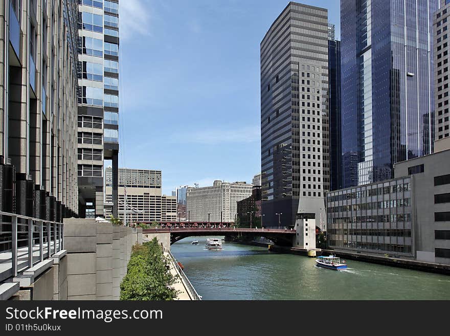 Architectural tour boat traveling down Chicago River. Architectural tour boat traveling down Chicago River