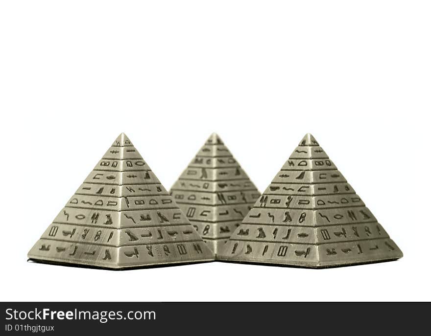 Metal Imitation Of Egyptian Pyramid Macro Isolated On White Background. Metal Imitation Of Egyptian Pyramid Macro Isolated On White Background