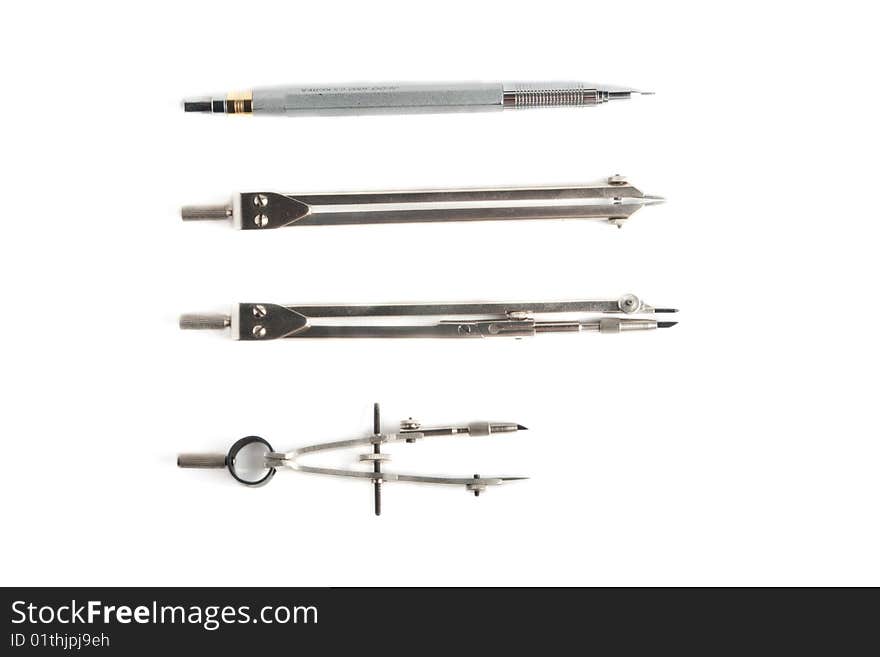 Three compasses and pencil on a white background. Three compasses and pencil on a white background