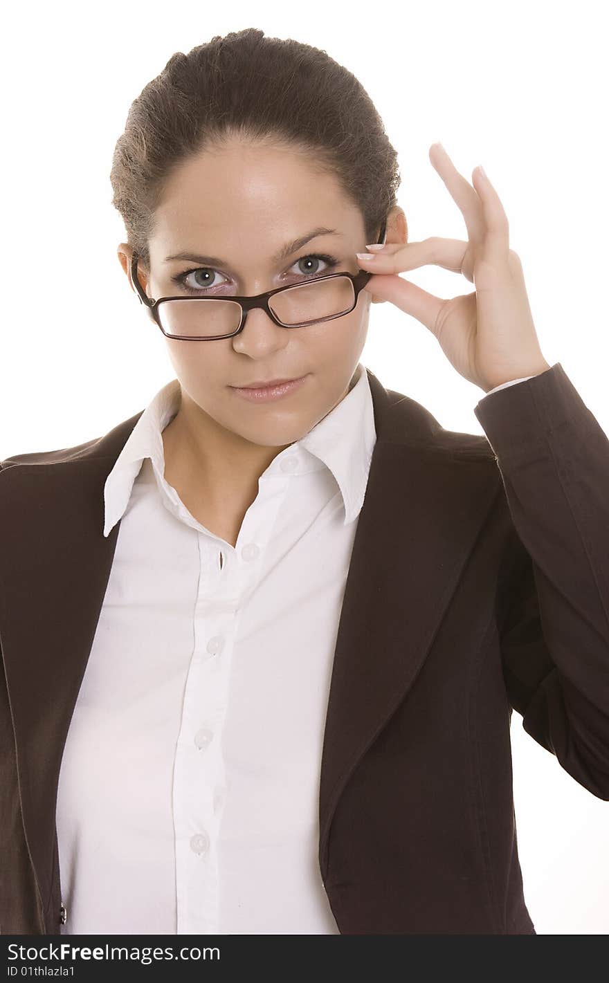 Young Woman Looking Over The Top Of Her Glasses