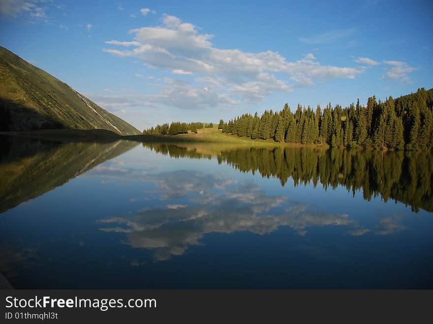 Lake in mountains. Gorge Grigoevskoe in Kyrgyzstan