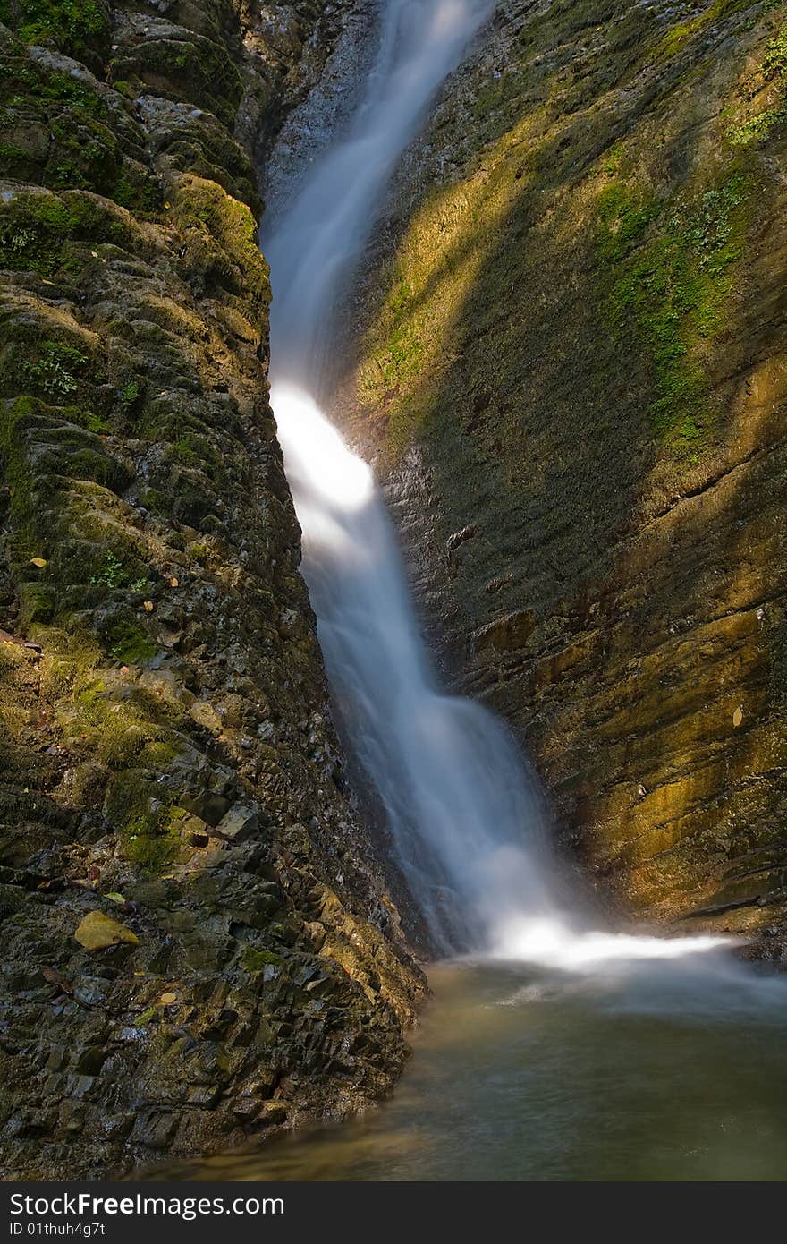 Fast water stream in brown stones