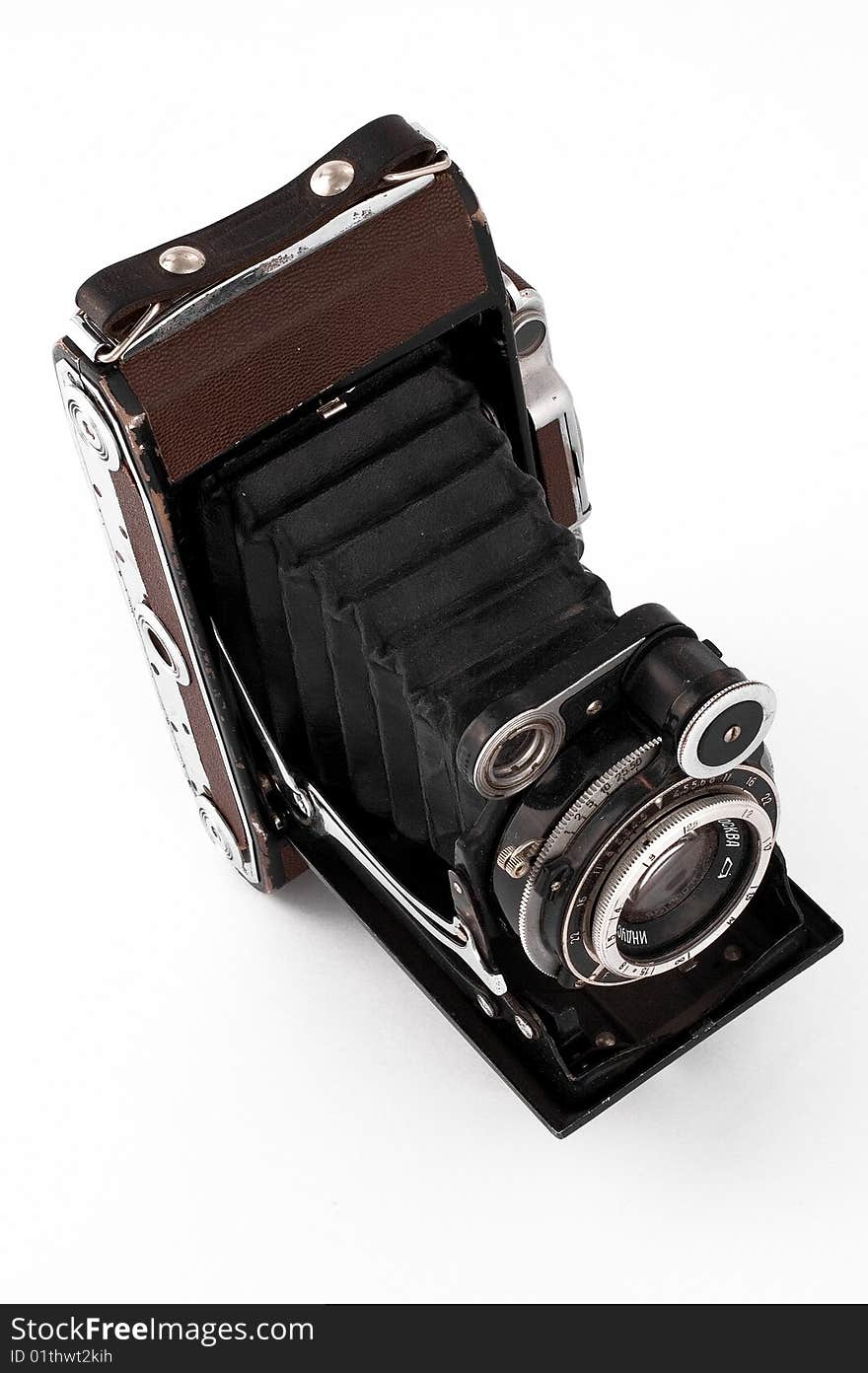 The isolated old camera costs on a white background. The isolated old camera costs on a white background