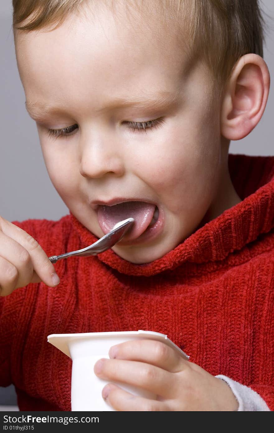 Boy eating yogurt