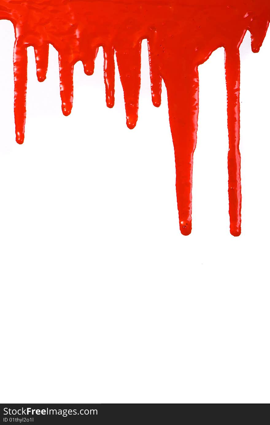 Red paint pouring on white background