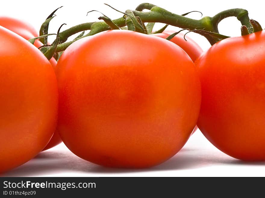 Fresh tomatoes. Macro studio isolated on white.