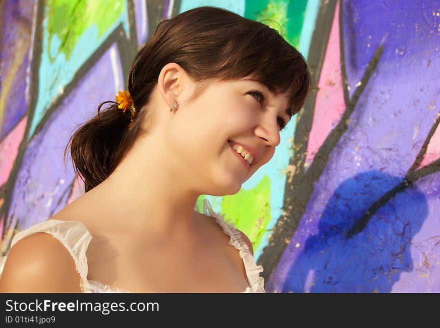 Women's portrait on a colored wall background