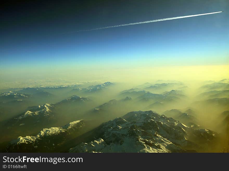 Flying over the Alps, sun and snow