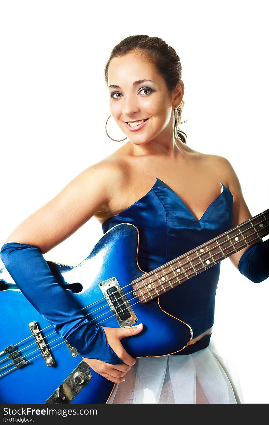 Portrait of a young brunette woman playing the guitar. Portrait of a young brunette woman playing the guitar