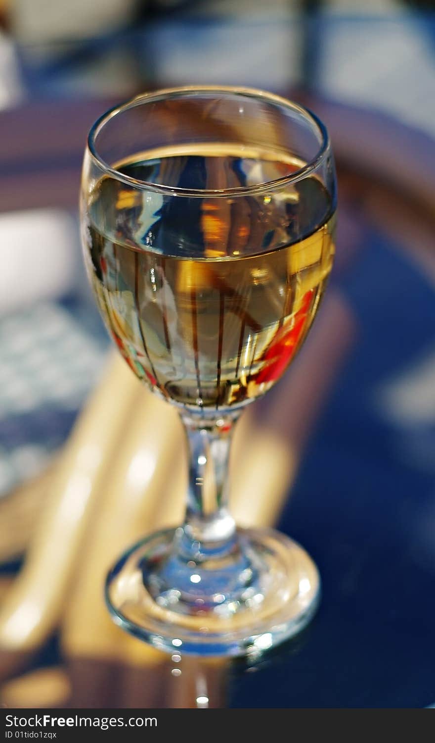 Wineglass in street cafe with shallow dof