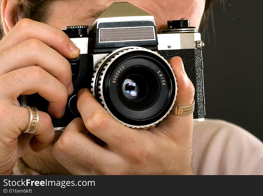 closeup of a classic photographer with an old film camera