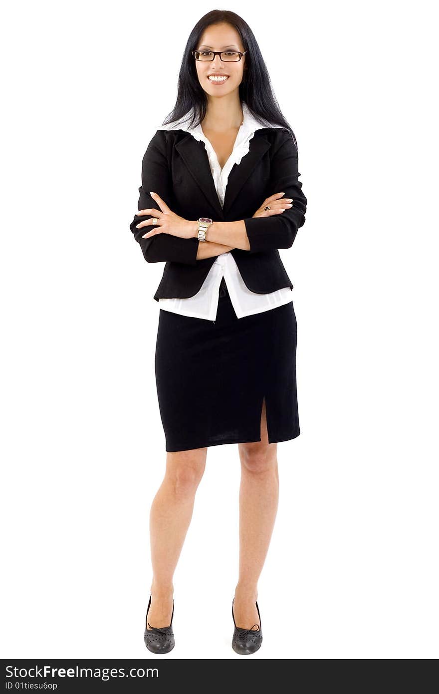 Attractive businesswoman standing on a white background with hands crossed