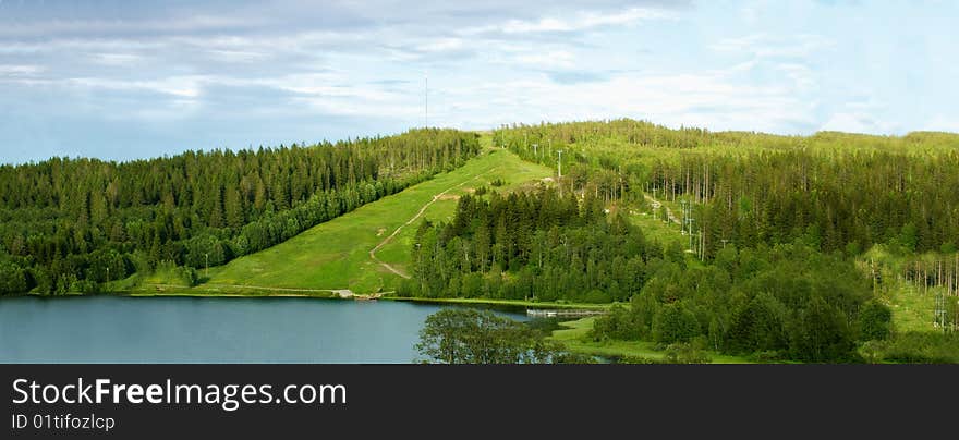 Green hills with a lake