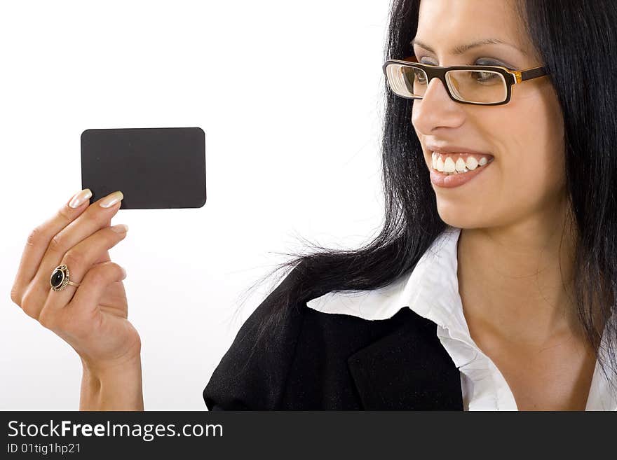 Closeup of an ttractive businesswoman holding and looking at a blank card. Closeup of an ttractive businesswoman holding and looking at a blank card