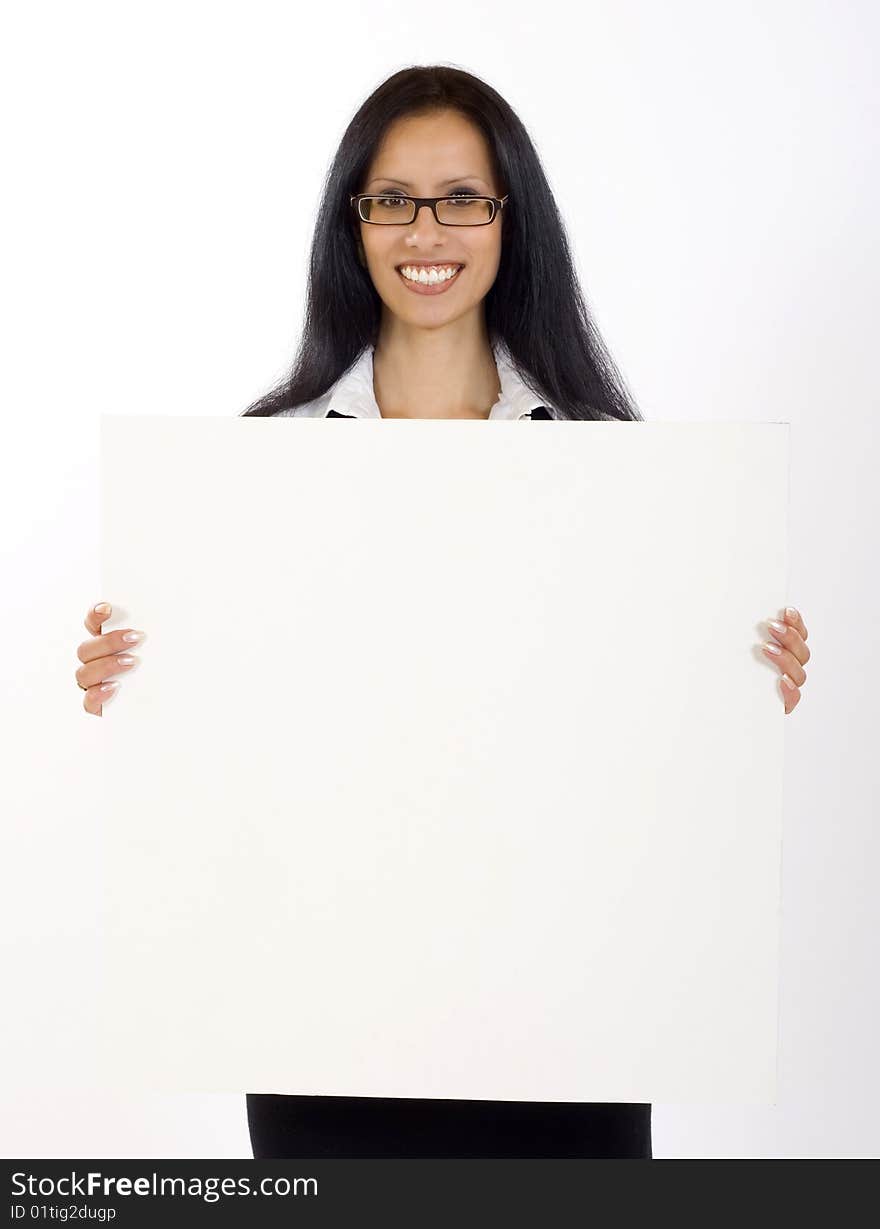 Attractive businesswoman holding a blank board