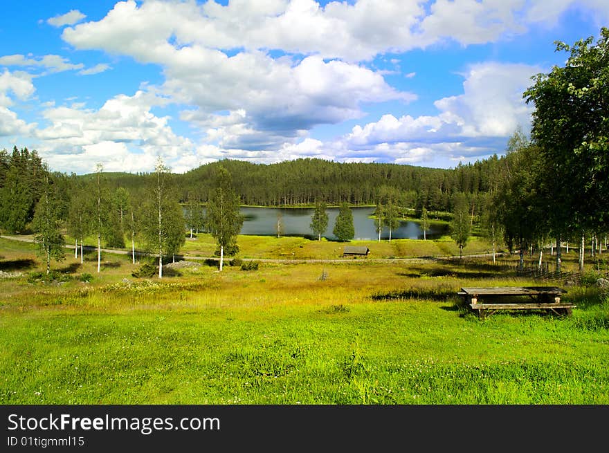 Green Hills With A Lake