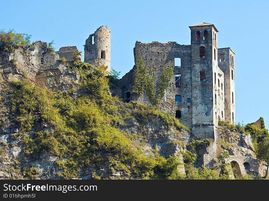 Dolceacqua is dominated by the famous bridge that spans the river from the old town to the more modern part. In the photo ancient ruins of the Doria Castle. Dolceacqua is dominated by the famous bridge that spans the river from the old town to the more modern part. In the photo ancient ruins of the Doria Castle.