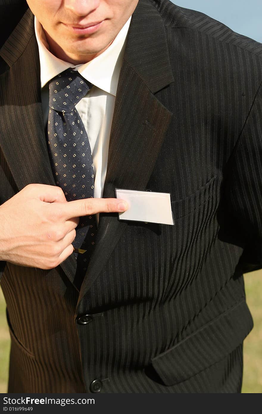 Businessman pointing on empty card with his finger