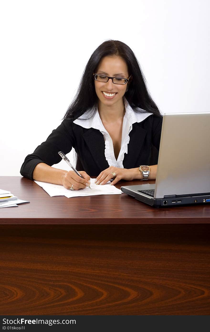 Attractive businesswoman at her desk