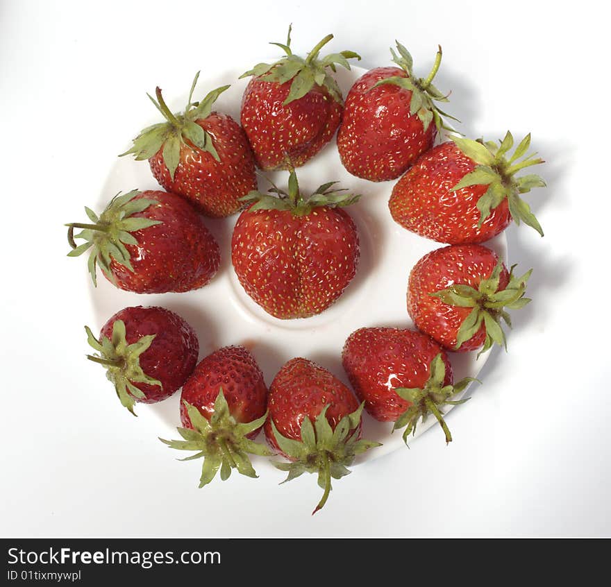 Fresh and tasty strawberries on white plate