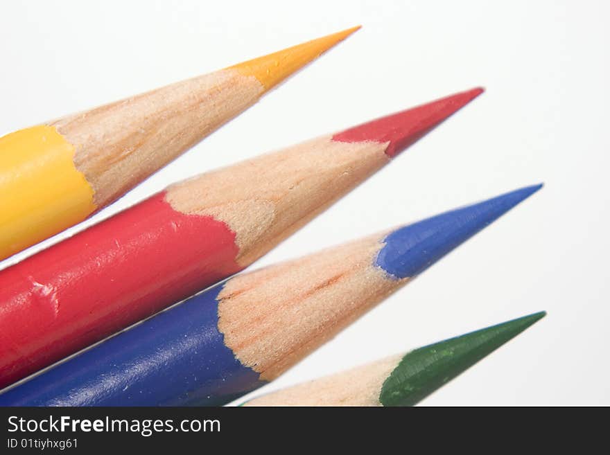 Close up of blue, yellow, red, and green sharp colored pencils. Close up of blue, yellow, red, and green sharp colored pencils