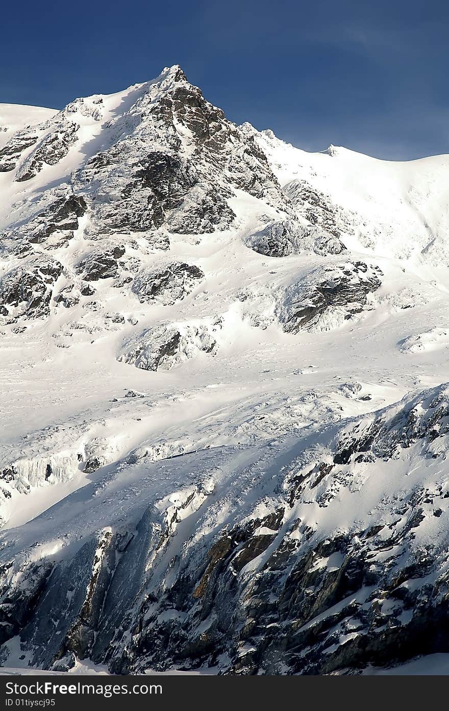 Snowed mountain peak in romania on a beautiful sunny day