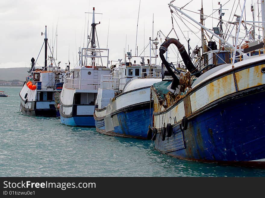 Fishing and lobster boats in Kalk Bay harbor, South Africa. Fishing and lobster boats in Kalk Bay harbor, South Africa