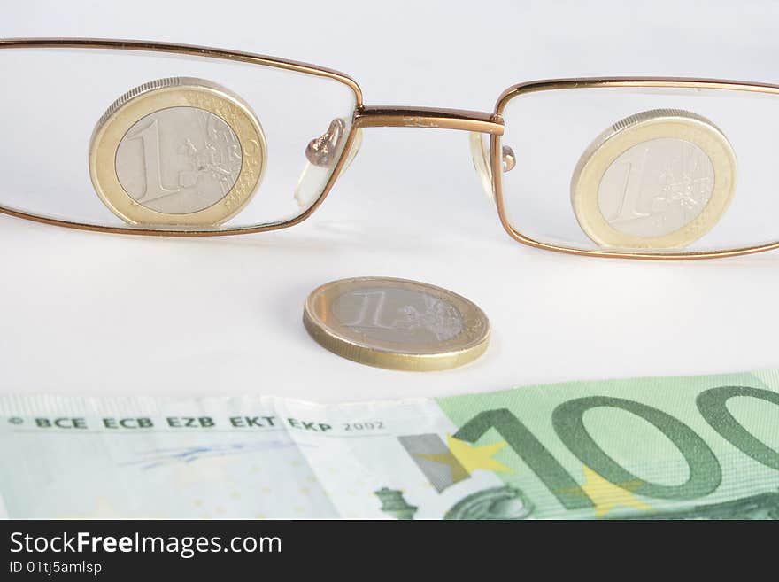 Glasses coins and banknote look like smile