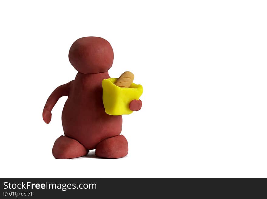 Plasticine customer keeping a bag with a bread isolated over white background. Plasticine customer keeping a bag with a bread isolated over white background