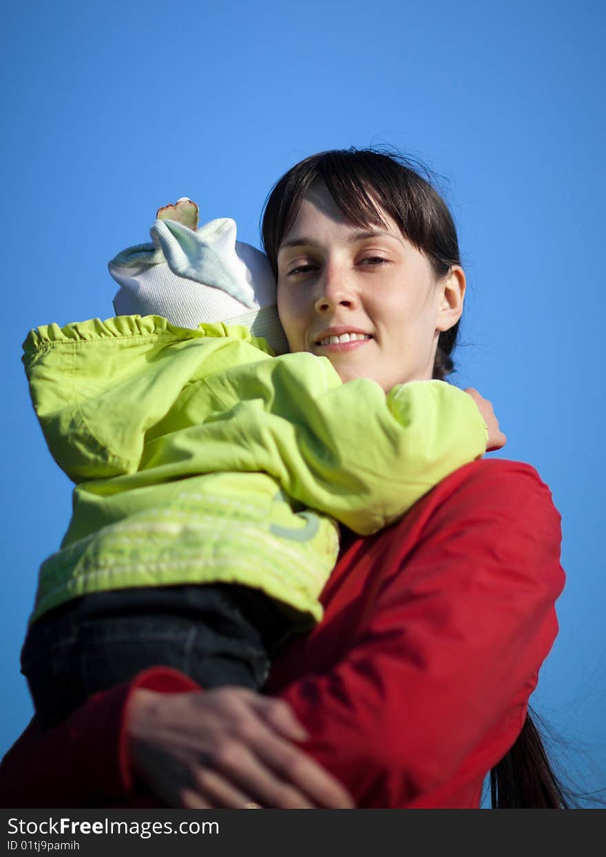 Portrait of a baby with mom outdoors - shallow DOF