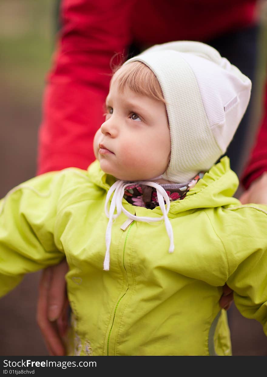 Portrait of an interested baby outdoors - shallow DOF. Portrait of an interested baby outdoors - shallow DOF