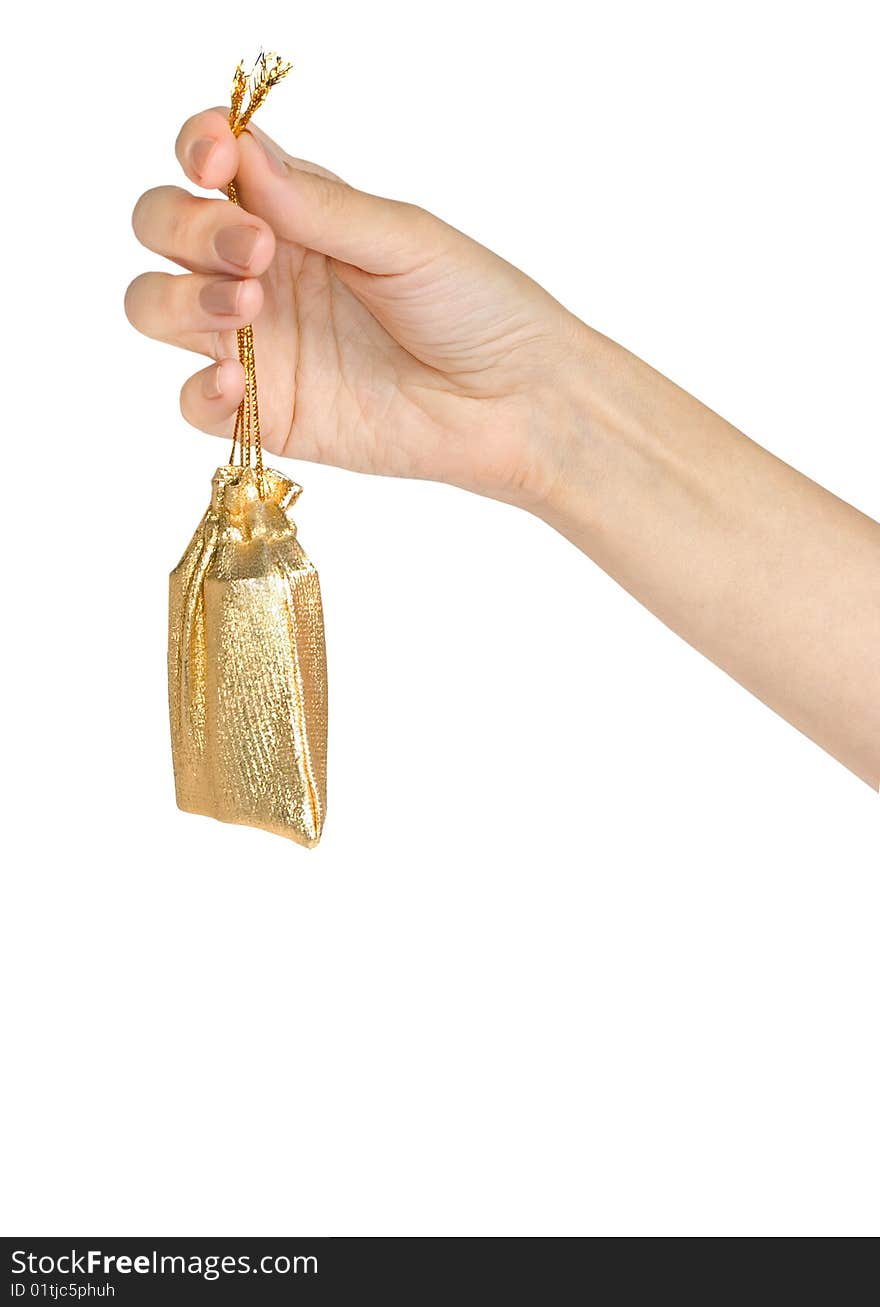 Womanish hand holds a little gold sac isolated on white. Womanish hand holds a little gold sac isolated on white