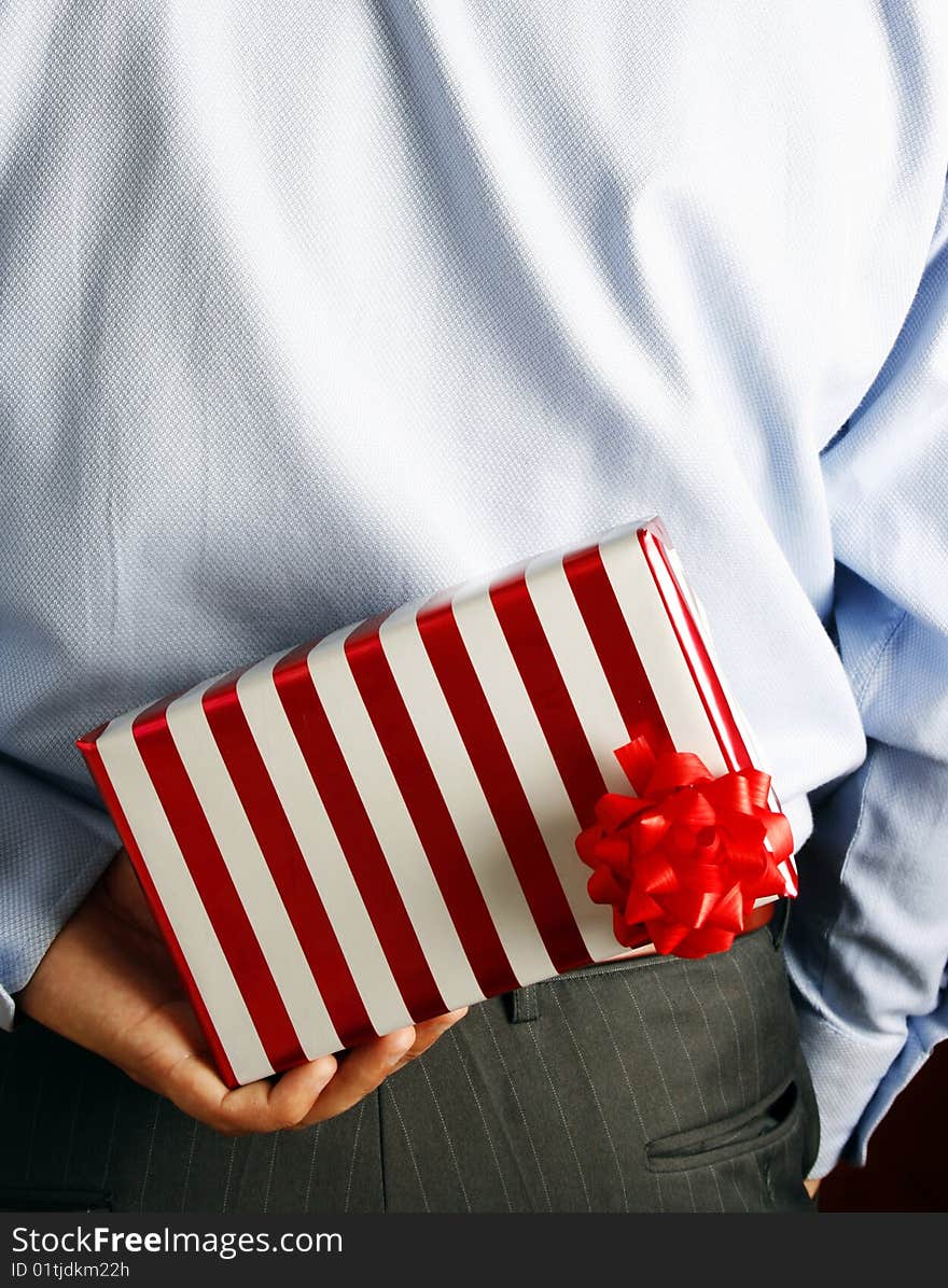 Businessman hiding a gift