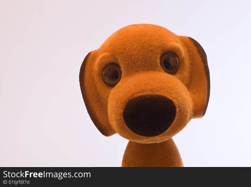 A cute toy puppy looking at you