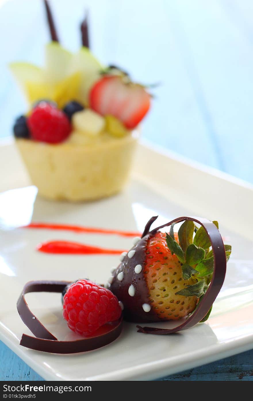 Chocolate coating strawberry and fruit tart.