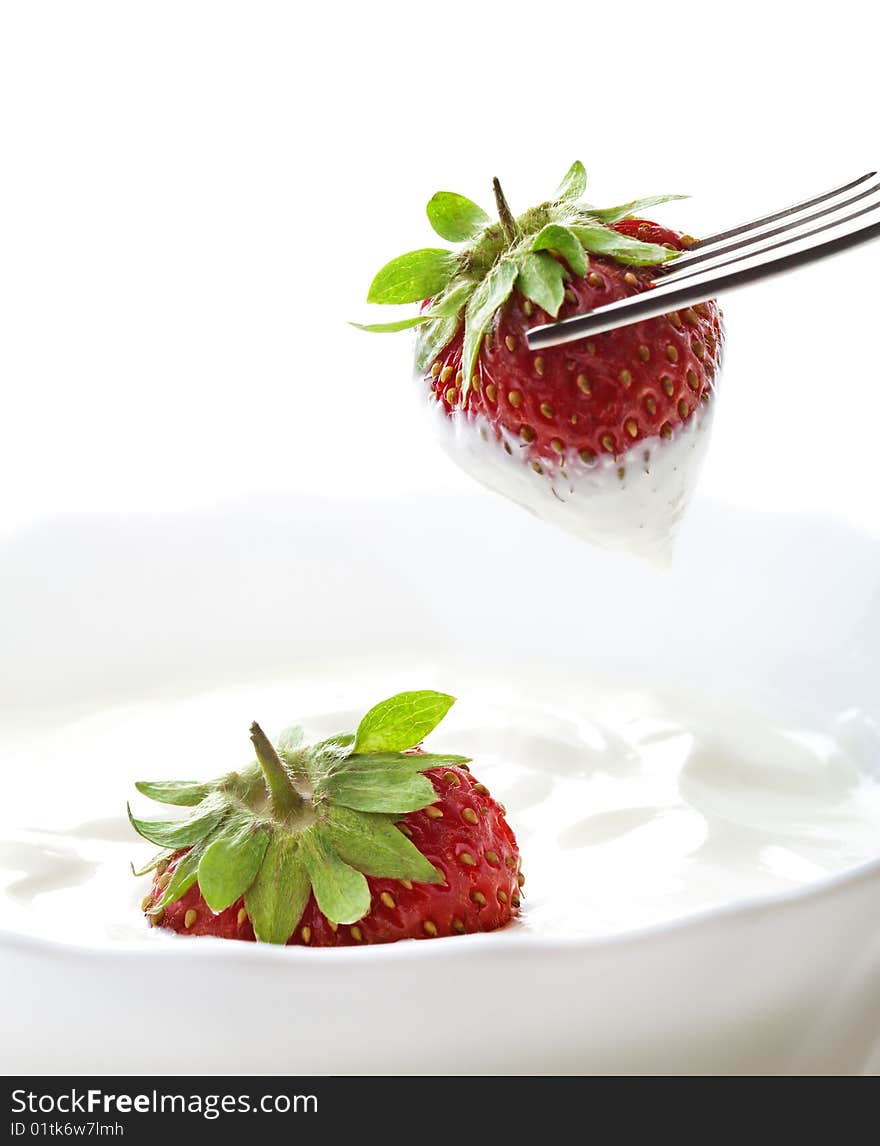 Strawberry with cream on white background