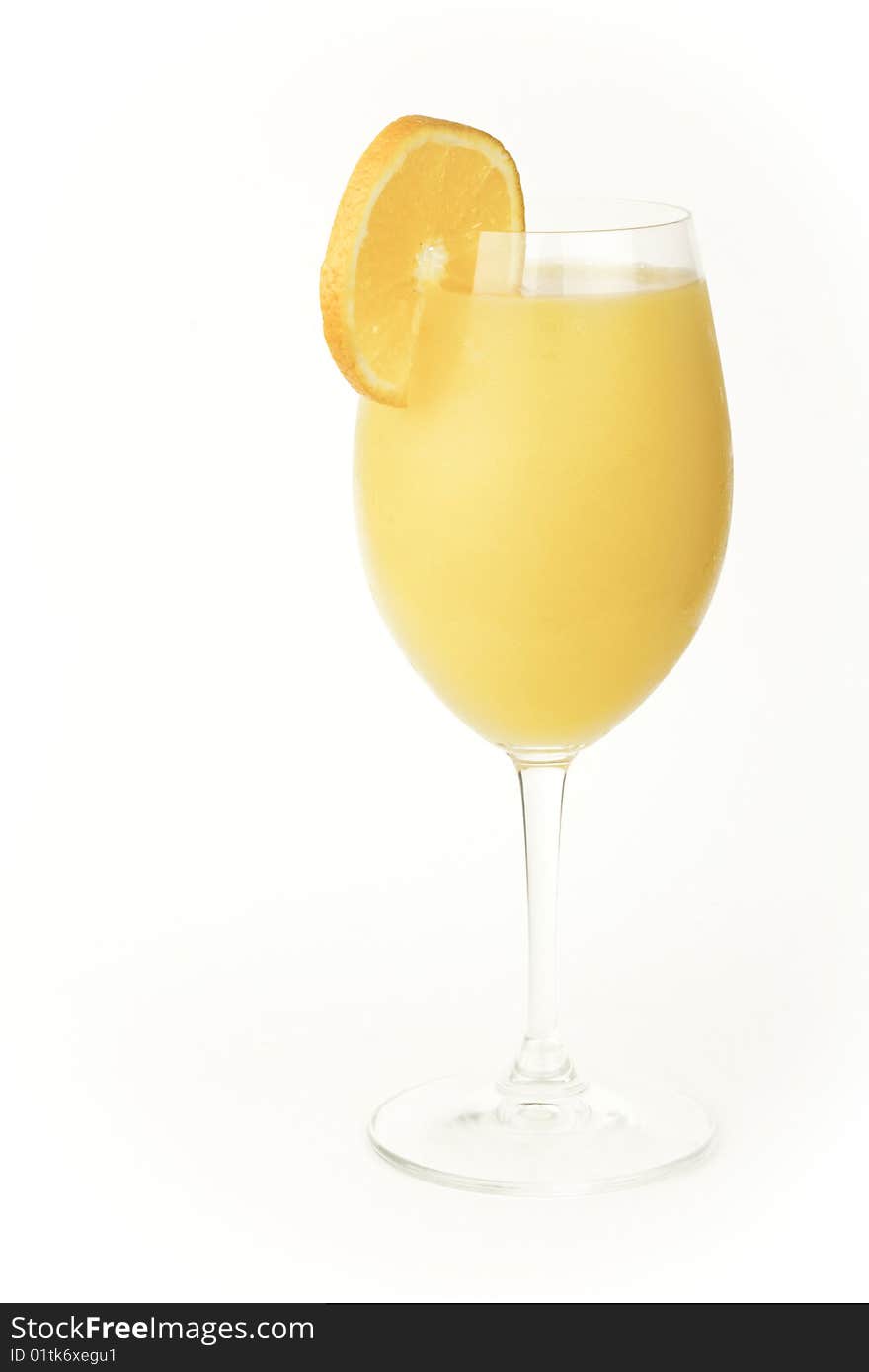 An orange drink isolated against a white background. An orange drink isolated against a white background