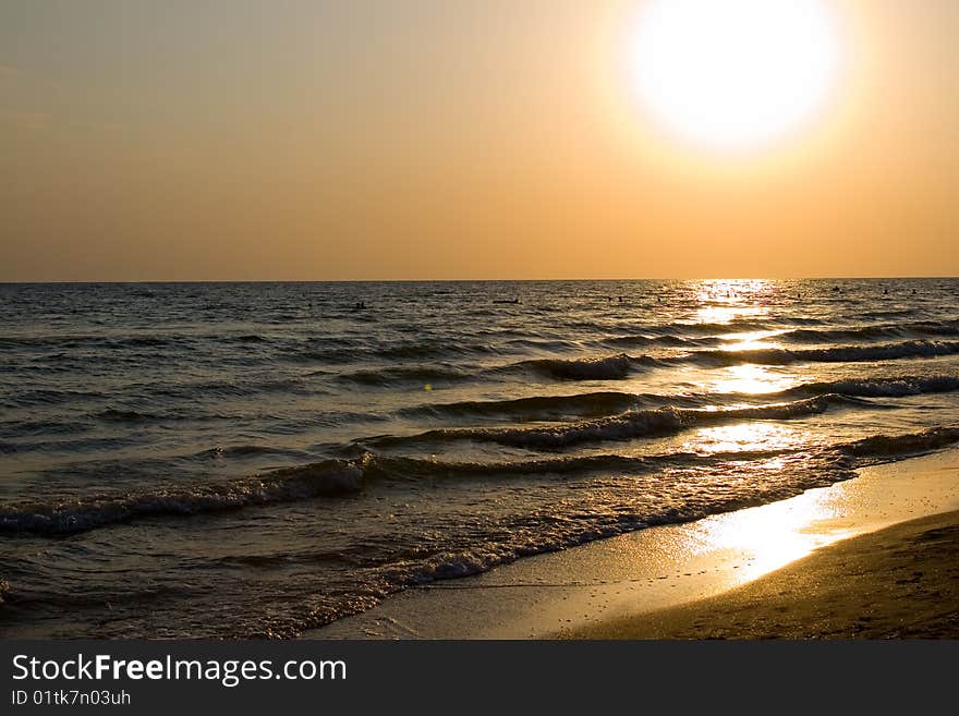 Sunset at coast of the sea