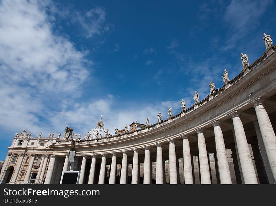 Religious Catholicism sculpture on roof against blue sky. Religious Catholicism sculpture on roof against blue sky