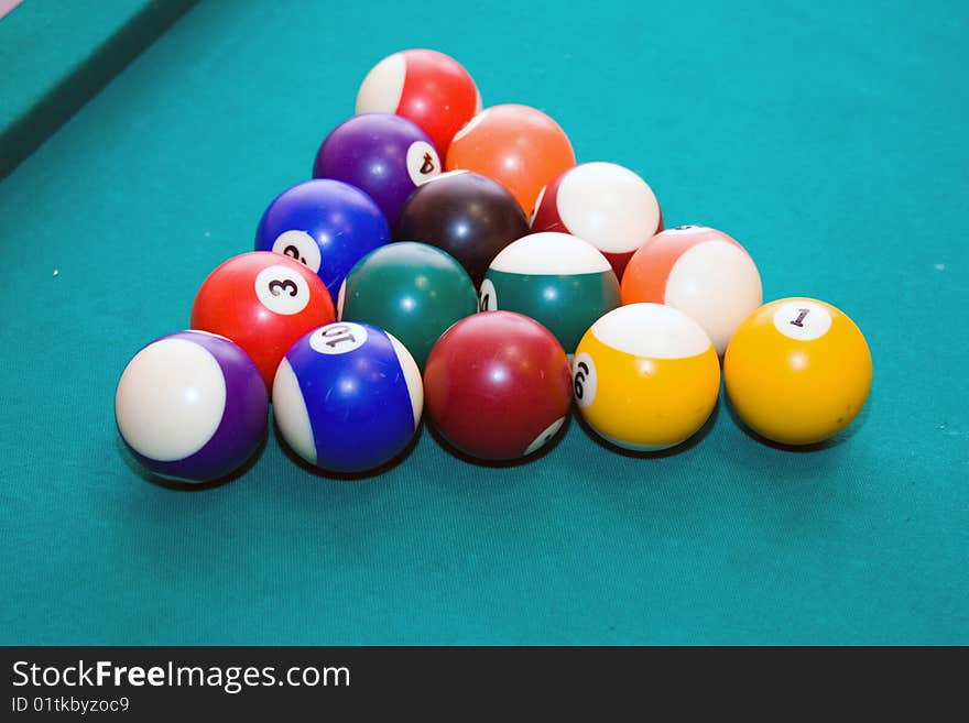 Billiard balls on a green background