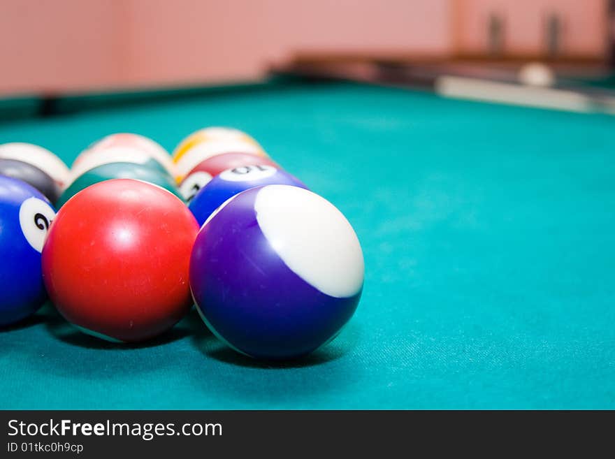 Billiard balls on a green background