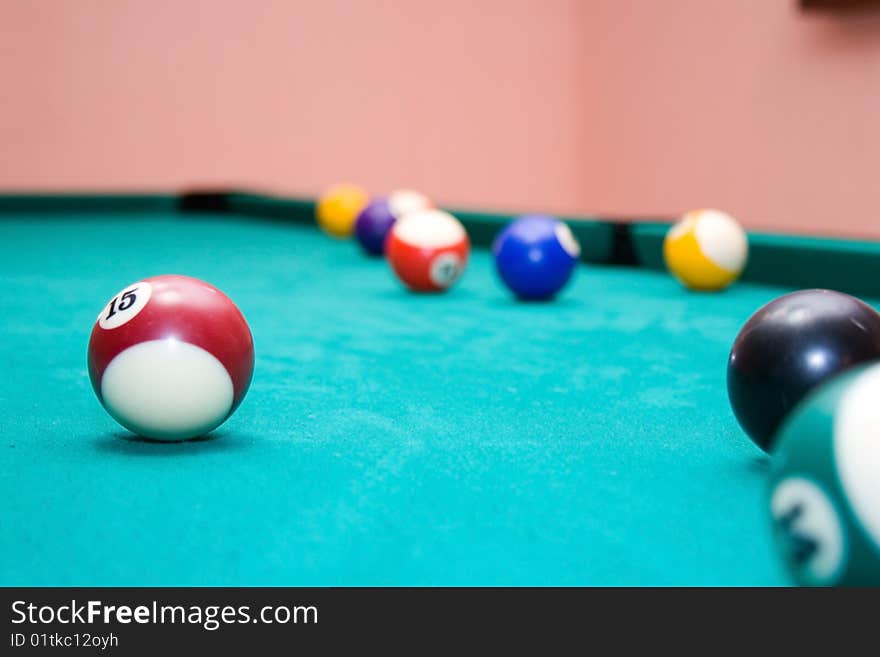 Billiard balls on a green background