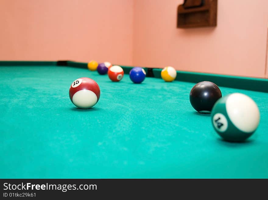 Billiard balls on a green background