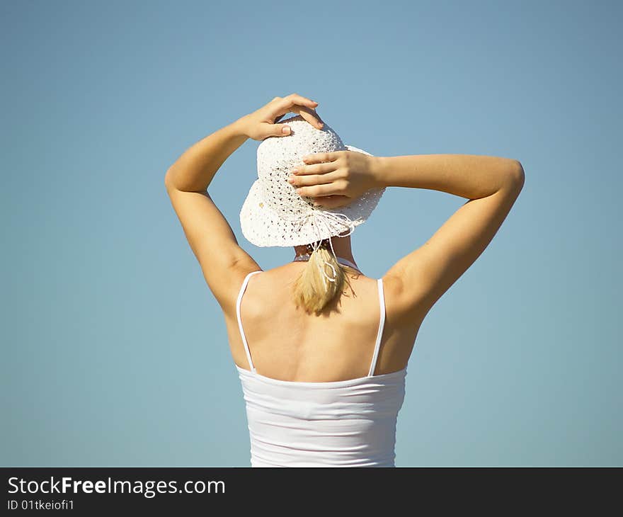 The young woman in white clothes on rest in the summer on the nature