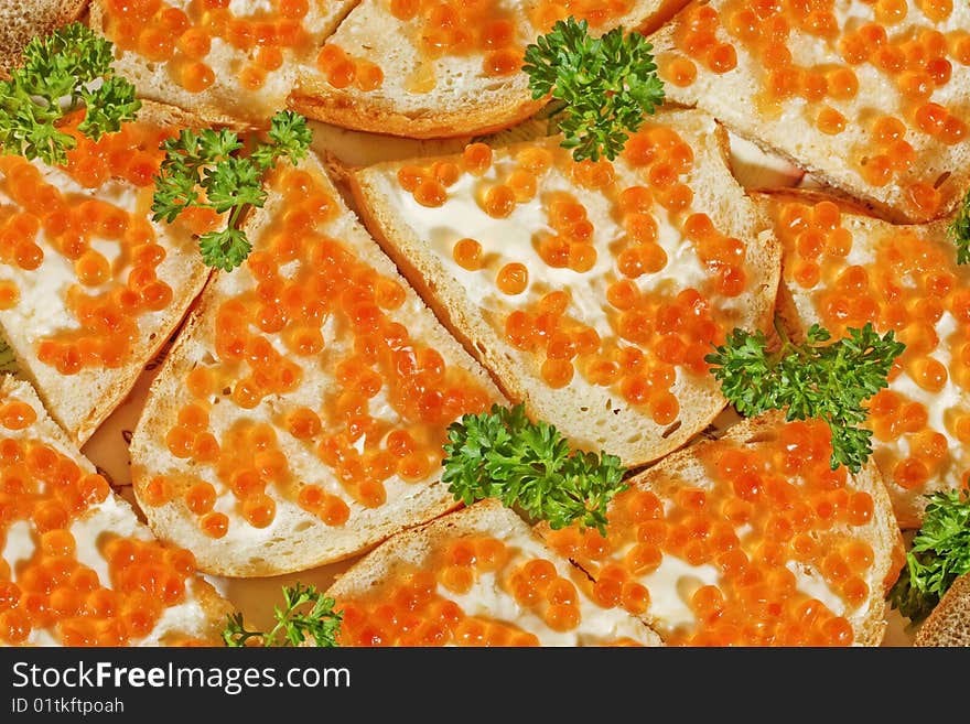 Sandwiches with butter and red caviar