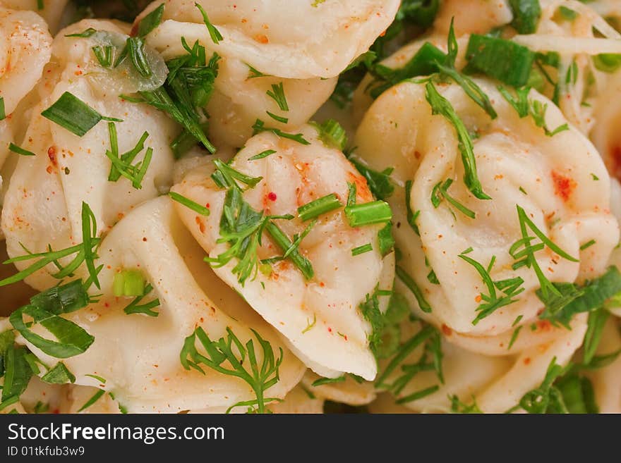 Appetizing ravioli with herbs and spices close up