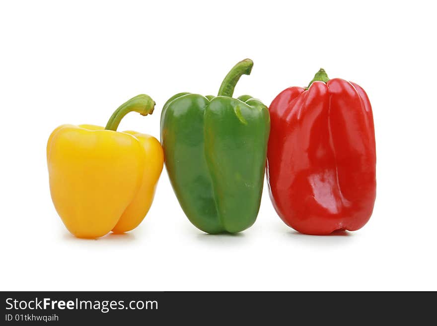 Yellow, red and green pepper isolated on white background