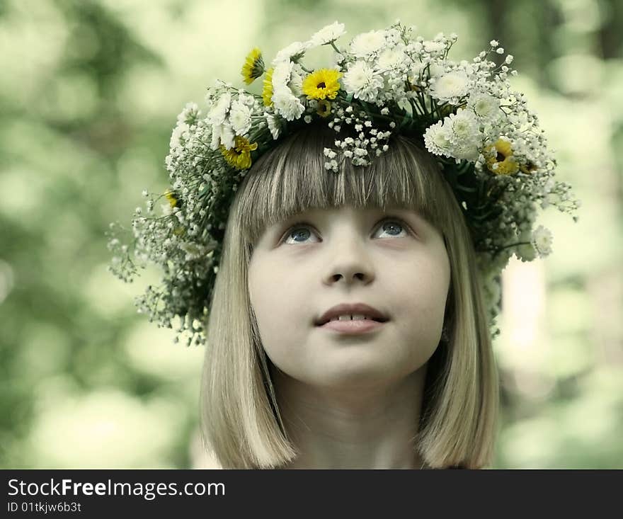 The girl in a flower wreath.